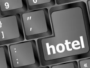 Traveler comparing hotel reviews and ratings on a booking website before reserving a room